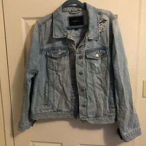 Distressed plus sized women's denim jacket